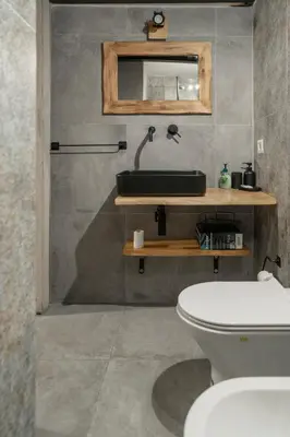 a bathroom with a sink and a toilet at Home Domus Capocci - Rione Monti in Rome