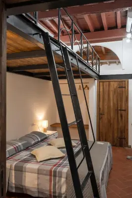 a bunk bed in a room with two bunk beds at Home Domus Capocci - Rione Monti in Rome