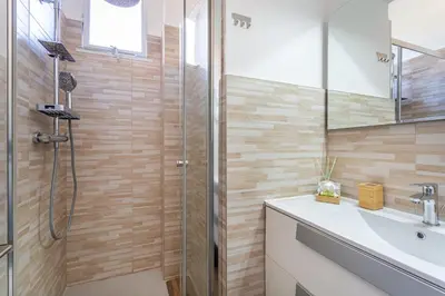 a bathroom with a shower and a sink at La casa di Elba in Rome