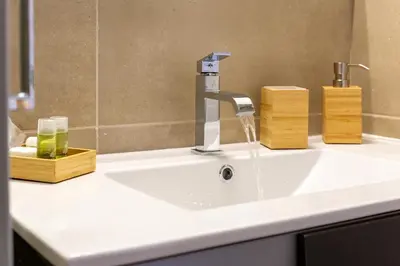 a bathroom sink with a faucet on a counter at La casa di Elba in Rome