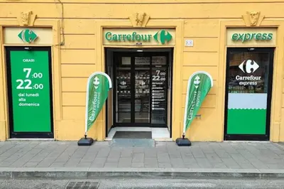 a store with green doors and signs in front at Non prenotate in Rome