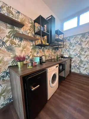 a kitchen with a washer and dryer in a room at Sweet RHome in Rome
