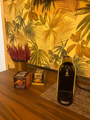 a table with a phone on top of a table at Sweet RHome in Rome