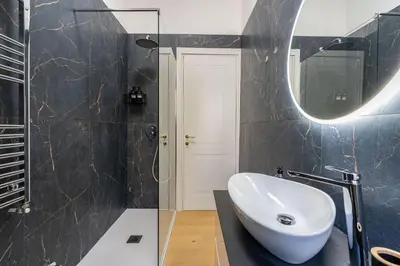 a bathroom with a sink and a mirror at Metro A 3 fermate da San Pietro - 2 Camere Luminoso - Domus Valeria in Rome