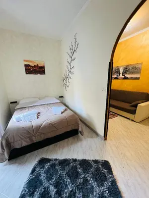 a bedroom with a bed and a mirror at Casa vacanza La Rosa di Oscar - Testaccio in Rome
