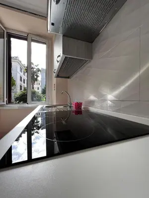 a kitchen with a sink and a window at Casa vacanza La Rosa di Oscar - Testaccio in Rome