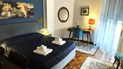 a bedroom with a bed with white towels on it at Trastevere Welcome Home Superior in Rome