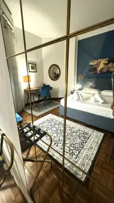 a hotel room with a bed and a mirror at Trastevere Welcome Home Superior in Rome