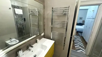 a bathroom with a sink and a mirror at Trastevere Welcome Home Superior in Rome