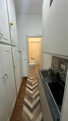 a small kitchen with a sink and a toilet at Trastevere Welcome Home Superior in Rome