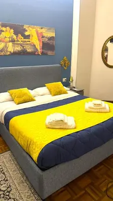 a bedroom with two beds with towels on them at Trastevere Welcome Home Superior in Rome