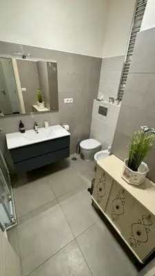 a bathroom with a sink and a toilet at Trastevere Welcome Home Deluxe 2 in Rome