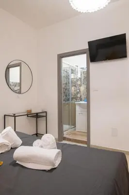 a bedroom with a bed with two towels on it at Gmm in Rome