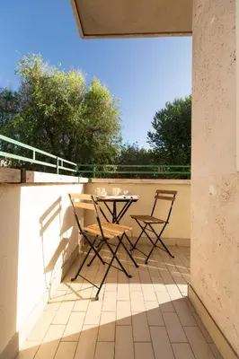 a patio with a table and chairs on a roof at Casa Sole in Rome