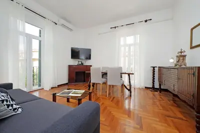 a living room with a couch and a table at 4BNB - Queen Mary Vatican Home in Rome