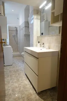 a bathroom with a white sink and a shower at Close to the Spanish Steps, WIFI, Air Cond, 2 bedrooms in Rome