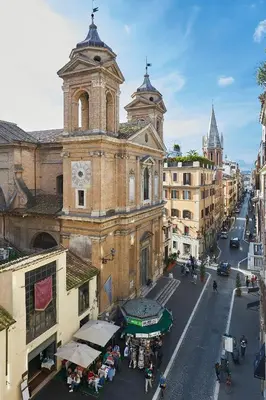 an old building with a clock tower on a city street at Close to the Spanish Steps, WIFI, Air Cond, 2 bedrooms in Rome