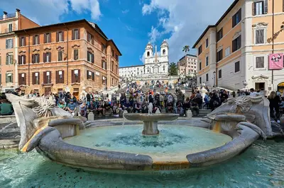 a fountain in a city with a group of people standing around it at Close to the Spanish Steps, WIFI, Air Cond, 2 bedrooms in Rome
