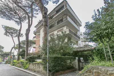 an apartment building on the side of a street at Rosso Levanto House in Rome