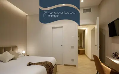 a hotel room with a bed and a sign that reads all suspension level manuscript at Daplace - Felicia Apartment in Rome