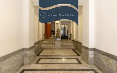 a hallway of a building with a sign that reads dedicated special cities at Daplace - Felicia Apartment in Rome