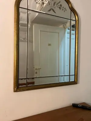 a mirror on a wall with a white wall at Hedi-Don sweet home-103 in Rome