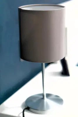 a white lamp sitting on top of a table at A casa di Pina - Roma St Peter in Rome
