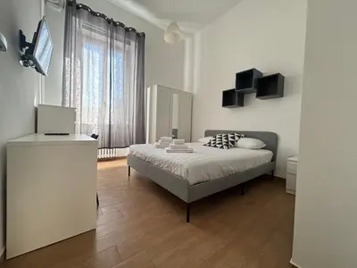 a bedroom with a bed and a television in it at Vaticano Apartment in Rome
