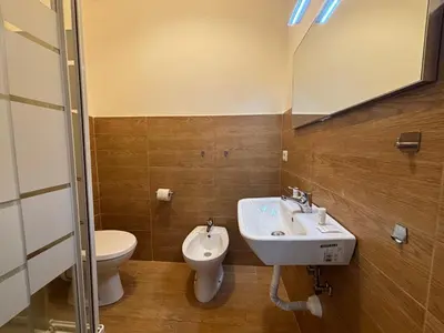 a bathroom with a sink and a toilet at Vaticano Apartment in Rome
