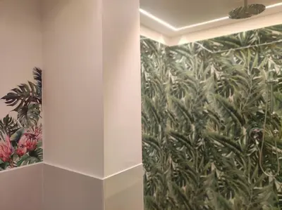 a bathroom with a wall with a mural of plants at Sweet Rome Holiday Flaminio-The biggest shower in Rome