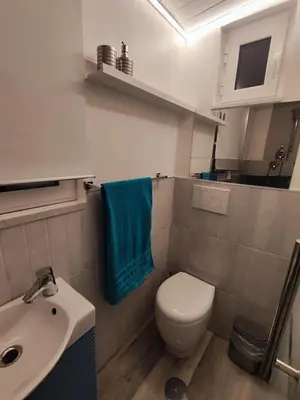a bathroom with a toilet and a sink at RomAmoR Spagna in Rome