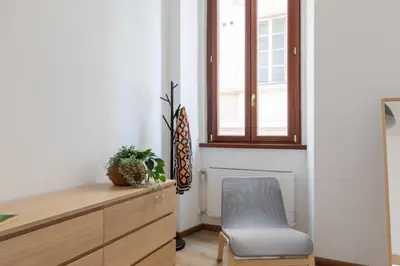 a room with a desk and a chair and a window at iFlat Bright Brand New 3-Bedroom Apt in Monti in Rome