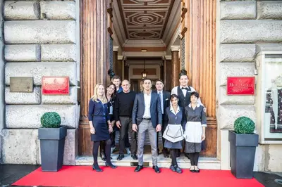 a group of people standing in front of a building at Vibe Nazionale in Rome