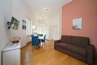 a living room with a couch and a table at Clivo 2 St Peter BuddyRent in Rome