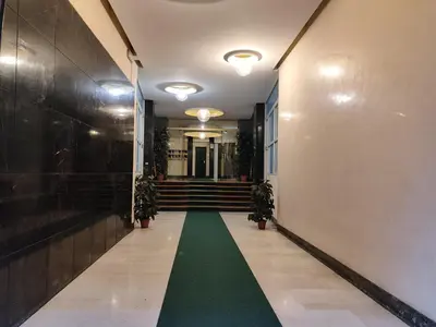 a hallway with a green floor in a building at A&B Vatican Domus in Rome