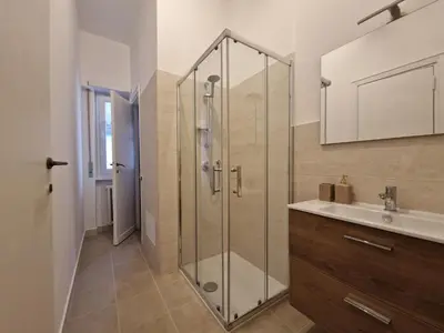 a bathroom with a shower and a sink at VIVA Rome Apartment 