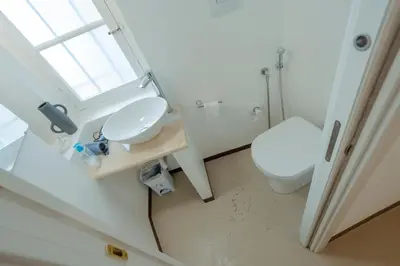 a bathroom with a toilet and a sink at Domus Superior Domizio - Pantheon in Rome