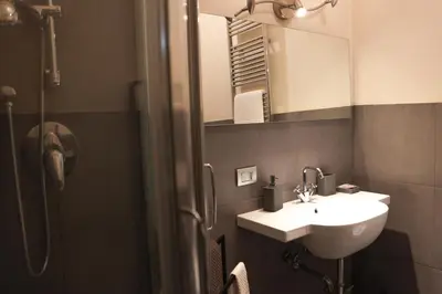 a bathroom with a sink and a mirror at Domus Superior Domizio - Pantheon in Rome