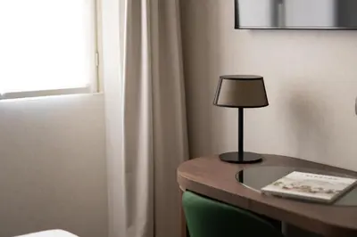 a lamp on a table in a room at Maison Roma Piazza di Spagna UNA Esperienze in Rome