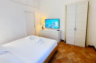 a bedroom with a bed and a glass table at Suite in appartamento in Rome