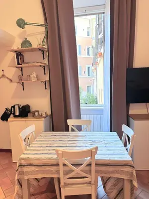 a bathroom with a sink and a mirror and a shelf at Suite in appartamento in Rome