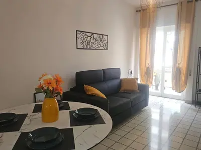 a living room with a couch and a table at R home of art in Rome