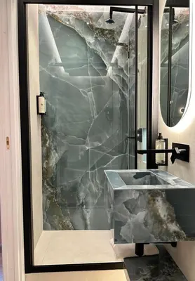 a bathroom with a marble sink and a mirror at Roma Luxury Stay 56 in Rome