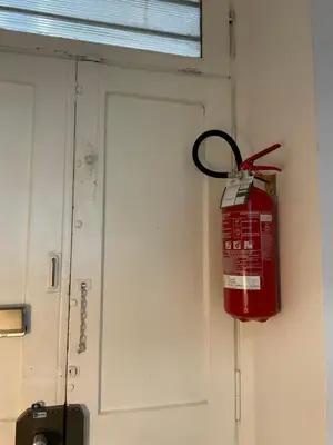 a fire hydrant hanging from a door in a room at CoolStayPigneto in Rome