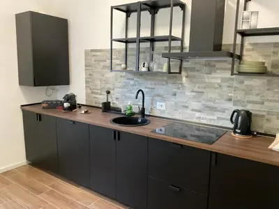 a kitchen with a sink and a counter top at CoolStayPigneto in Rome
