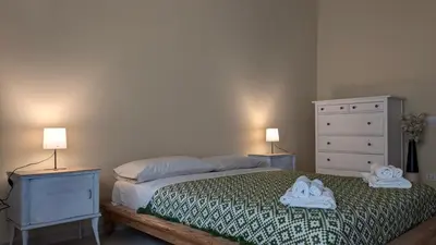 a bedroom with a bed with towels on it at Appartamento C9 in Rome