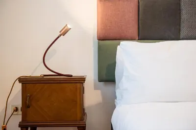 a bedroom with two white towels on a bed at Casa Geco Cozy apartment near St Peter in Rome