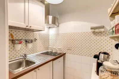a small kitchen with a sink and a counter top at Casa Dolce Casa in Rome