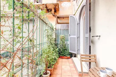 a small balcony with potted plants on a building at Casa Dolce Casa in Rome