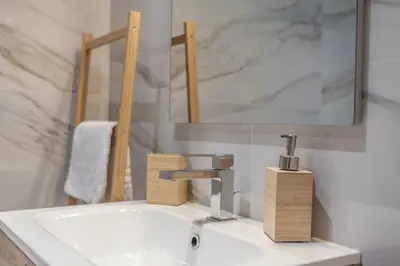 a bathroom with a white sink and a mirror at Domus 124, elegant city Comfort with Parking in Rome